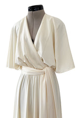 1970s Halston Draped Minimal Seamed Ivory Jersey Wrap Over Dress w Full Sleeves