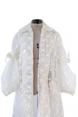 Spring 2017 Simone Rocha Runway Look 6 Transparent Raincoat w Embroidered Tulle Backing