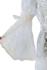 Spring 2017 Simone Rocha Runway Look 6 Transparent Raincoat w Embroidered Tulle Backing