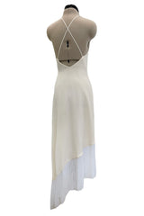 Recent Givenchy Ivory Crepe Silk Wrapped Angled Hem Dress w Cascading White Fringe