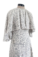 1970s James Galanos Soft Pale Grey & White Floral Print Silk & Silk Chiffon Caped Dress