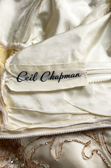 Incredible 1950s Ceil Chapman Ivory Silk Satin Dress w Gold Metal Ribbon Detailing