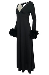 1970s Unlabeled Open Back Black Jersey Dress w Glossy Feather Cuffs