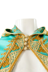 1970s Turquoise Jersey Cape with Gold Cord Braiding Detailing & Hood