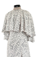1970s James Galanos Soft Pale Grey & White Floral Print Silk & Silk Chiffon Caped Dress