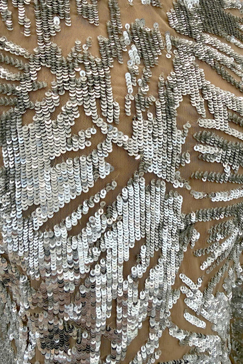 Spring 2018 Michael Kors Runway Look 72 Silver Sequin Dress on Nude Stretch Net w Asymmetrical Hem