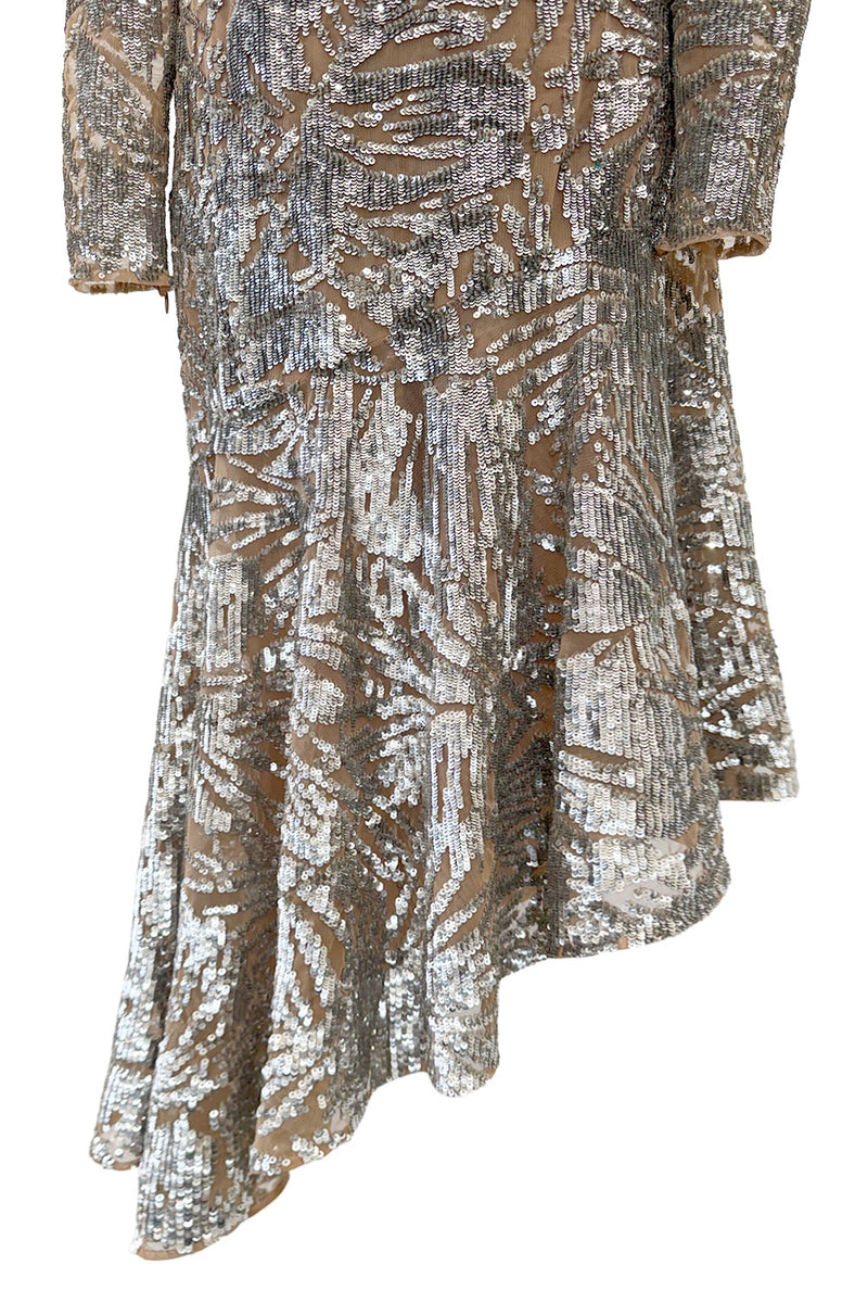 Spring 2018 Michael Kors Runway Look 72 Silver Sequin Dress on Nude Stretch Net w Asymmetrical Hem