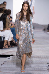 Spring 2018 Michael Kors Runway Look 72 Silver Sequin Dress on Nude Stretch Net w Asymmetrical Hem