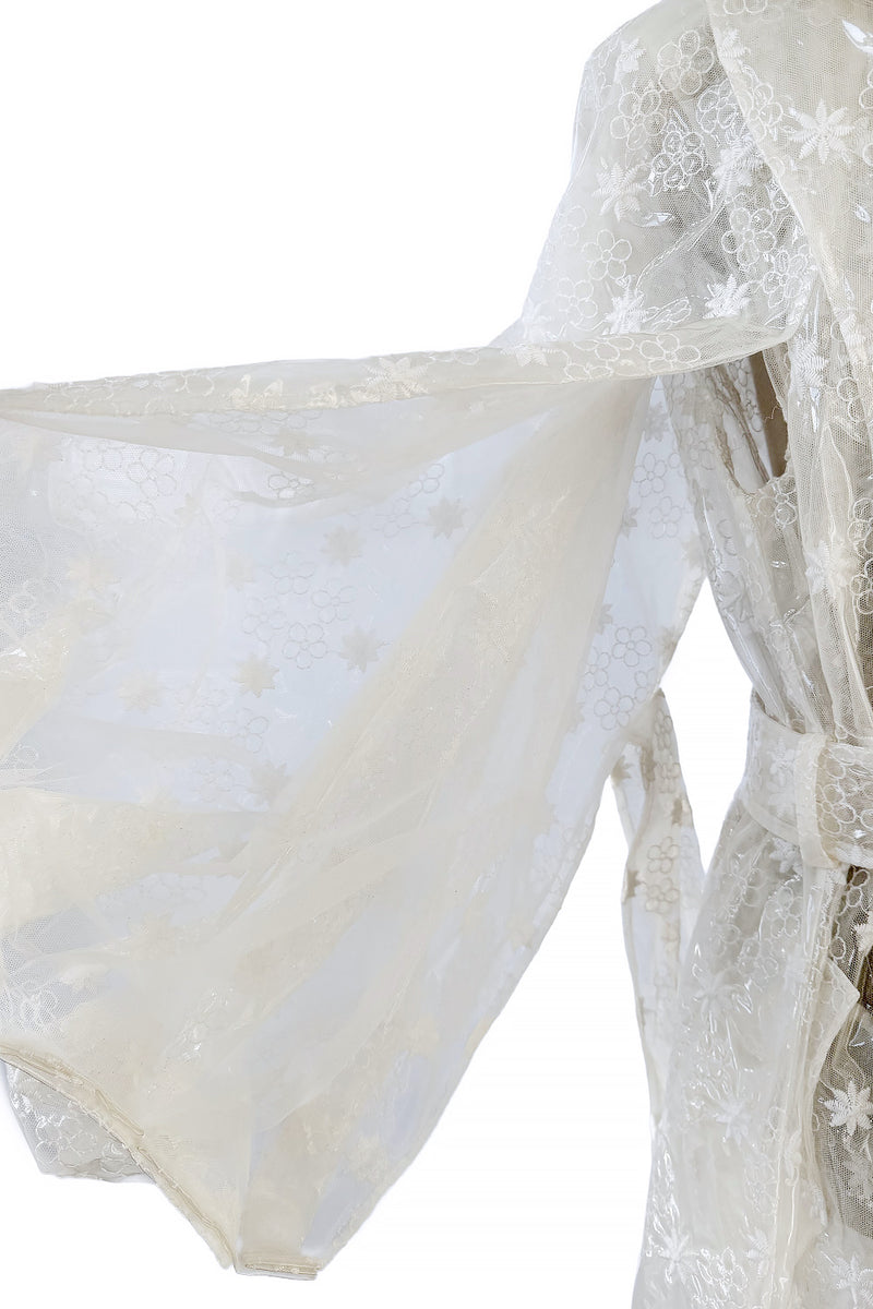 Spring 2017 Simone Rocha Runway Look 6 Transparent Raincoat w Embroidered Tulle Backing