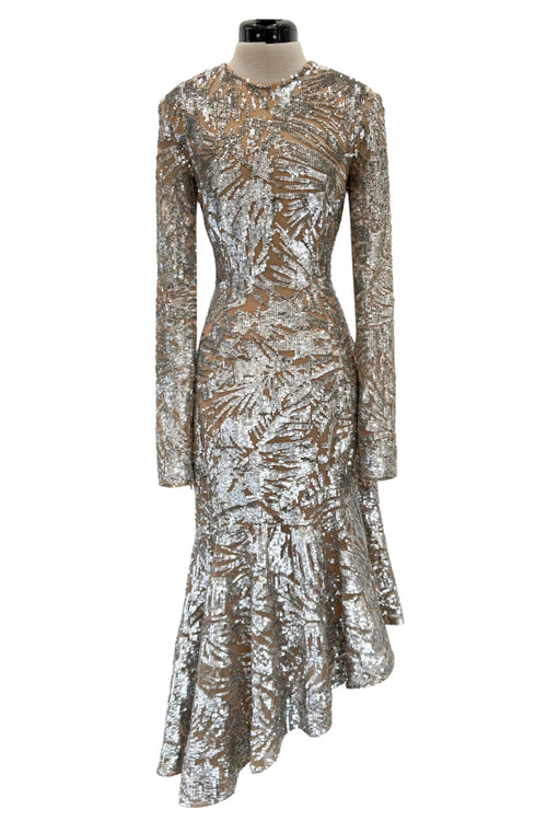 Spring 2018 Michael Kors Runway Look 72 Silver Sequin Dress on Nude Stretch Net w Asymmetrical Hem