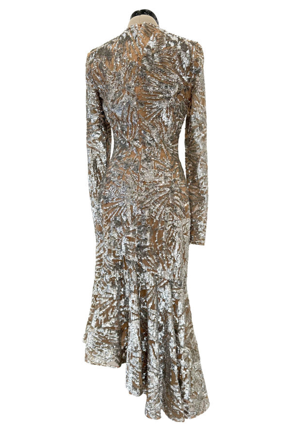 Spring 2018 Michael Kors Runway Look 72 Silver Sequin Dress on Nude Stretch Net w Asymmetrical Hem