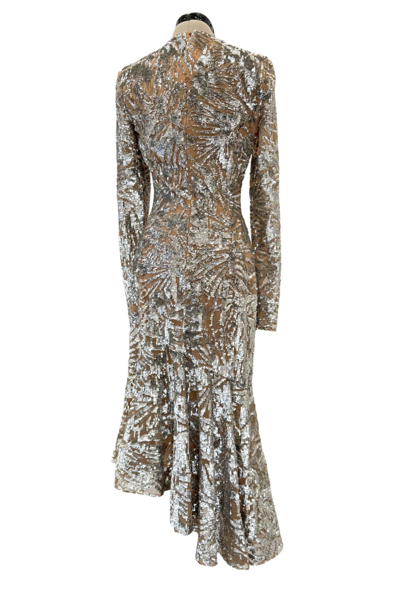 Spring 2018 Michael Kors Runway Look 72 Silver Sequin Dress on Nude Stretch Net w Asymmetrical Hem