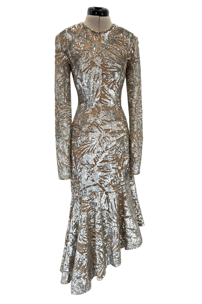 Spring 2018 Michael Kors Runway Look 72 Silver Sequin Dress on Nude Stretch Net w Asymmetrical Hem