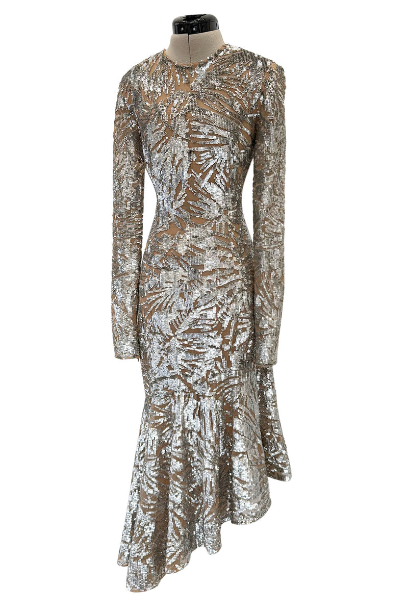 Spring 2018 Michael Kors Runway Look 72 Silver Sequin Dress on Nude Stretch Net w Asymmetrical Hem