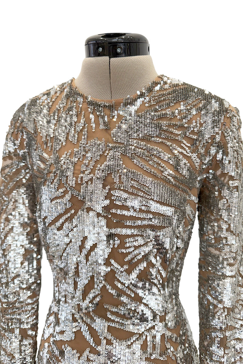 Spring 2018 Michael Kors Runway Look 72 Silver Sequin Dress on Nude Stretch Net w Asymmetrical Hem