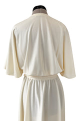 1970s Halston Draped Minimal Seamed Ivory Jersey Wrap Over Dress w Full Sleeves