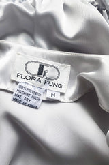Amazing 1980s Flora Kung Pale Silver Satin Jumpsuit w Plunge Neckline & Tie Waist