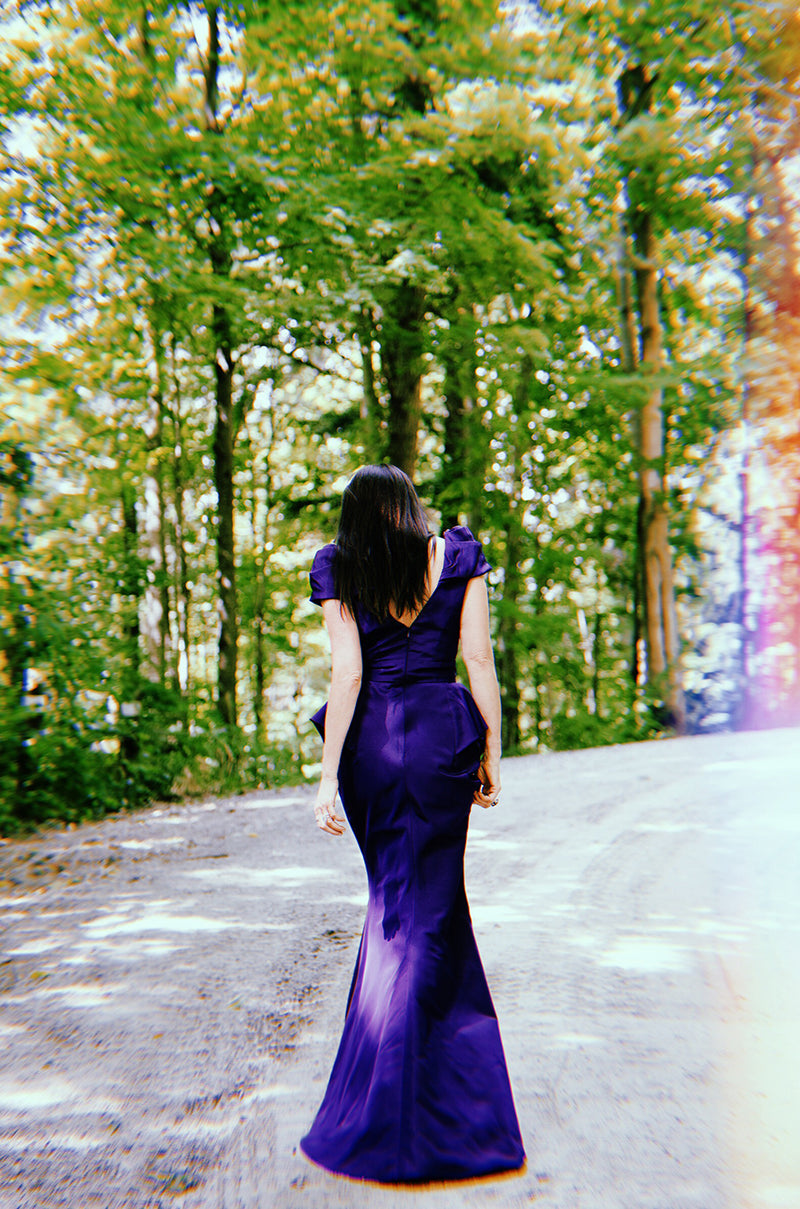 purple oscar dresses Wunmi Mosaku attended the Vanity Fair Oscar Party wearing a custom Georges Chakra Couture gown from the Spring/Summer 2026 collection. A lilac amethyst strapless column gown embroidered in a tonal geometric sequin
