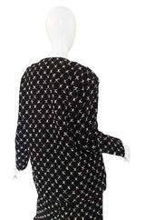 1980s Pearl Button Chanel Larger Boucle Suit